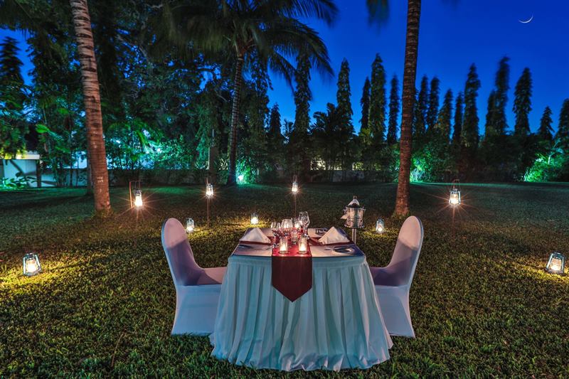 Lantern-lit garden dinner at night